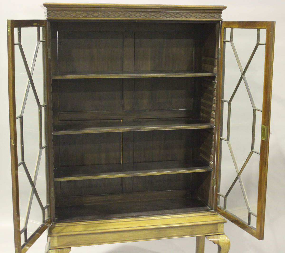 An Edwardian mahogany display cabinet-on-stand, enclosed by two astragal glazed doors, on cabriole - Image 3 of 4