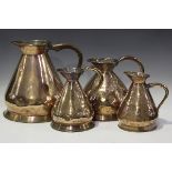 A group of four Victorian copper graduated 'haystack' measures, comprising 2 gallon, 1 gallon and