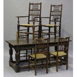 An early 20th century Jacobean Revival oak refectory table, the frieze carved with foliate