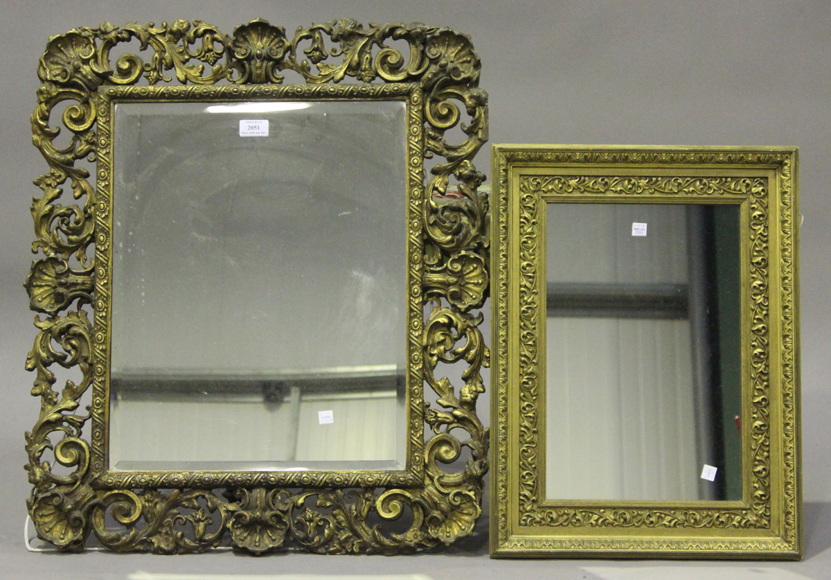 A 20th century gilt painted rectangular wall mirror, the bevelled glass within a frame of shells and