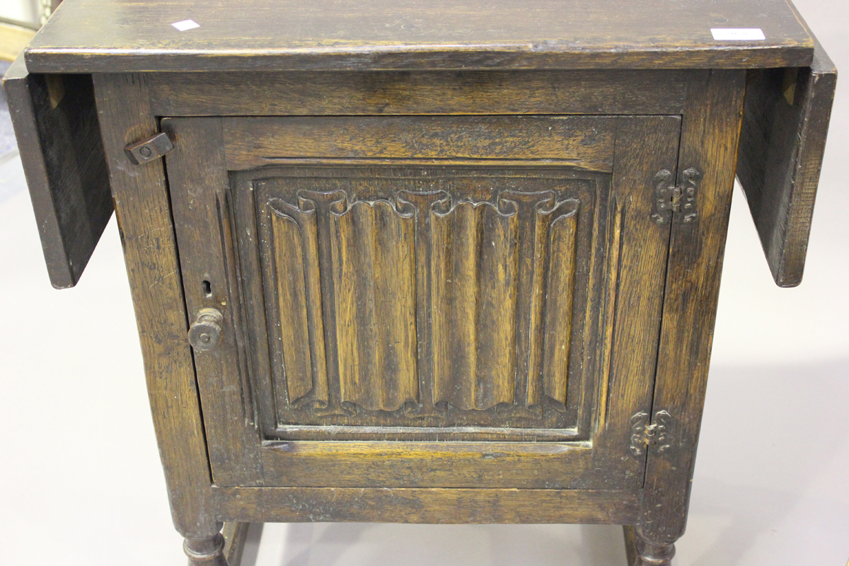 A mid-20th century oak drop-flap side cabinet, the door carved with a linenfold panel, height - Image 6 of 6