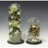 A Victorian wax still life arrangement of fruit and leaves, within a glass dome, height 30cm,