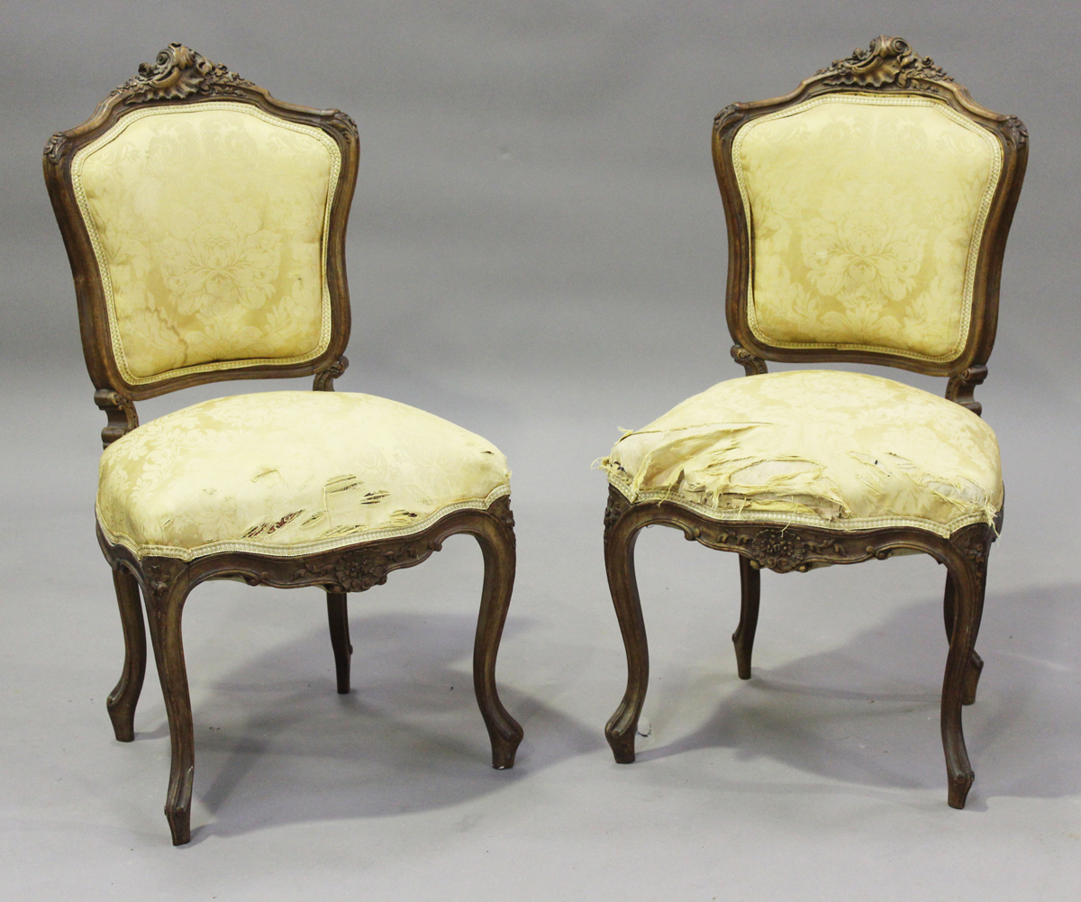 A late 19th century French Louis XV style walnut showframe salon suite, comprising a settee, - Image 11 of 12