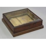 A late Victorian walnut cased table-top bijouterie display case, fitted with a bevelled glass top,