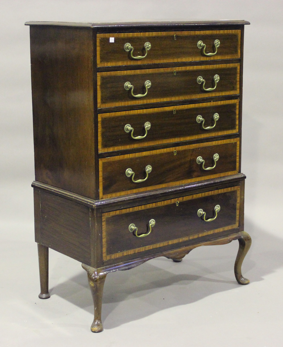 An early 20th century George III style mahogany and satinwood crossbanded chest, raised on