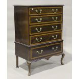 An early 20th century George III style mahogany and satinwood crossbanded chest, raised on