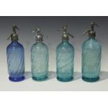 Four early 20th century French glass soda syphons, three of green tint and one blue, each with