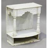 A carved alabaster shrine shelf, probably Indian, the carved foliate frieze above columns and a