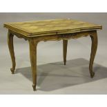 A 20th century French cherry parquetry veneered draw-leaf dining table, on cabriole legs, height