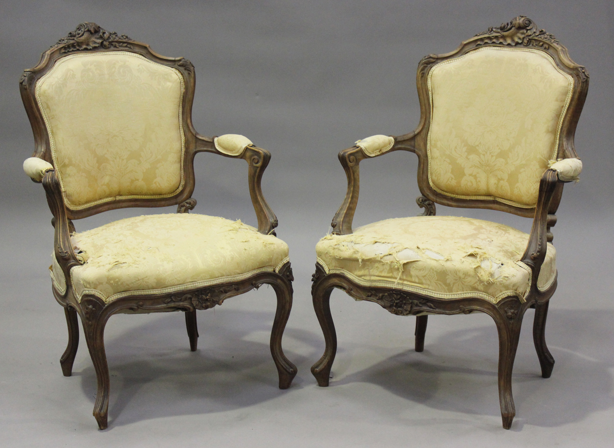 A late 19th century French Louis XV style walnut showframe salon suite, comprising a settee, - Image 12 of 12