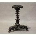 A 19th century South-East Asian carved hardwood jardinière stand, probably Burmese, the circular top