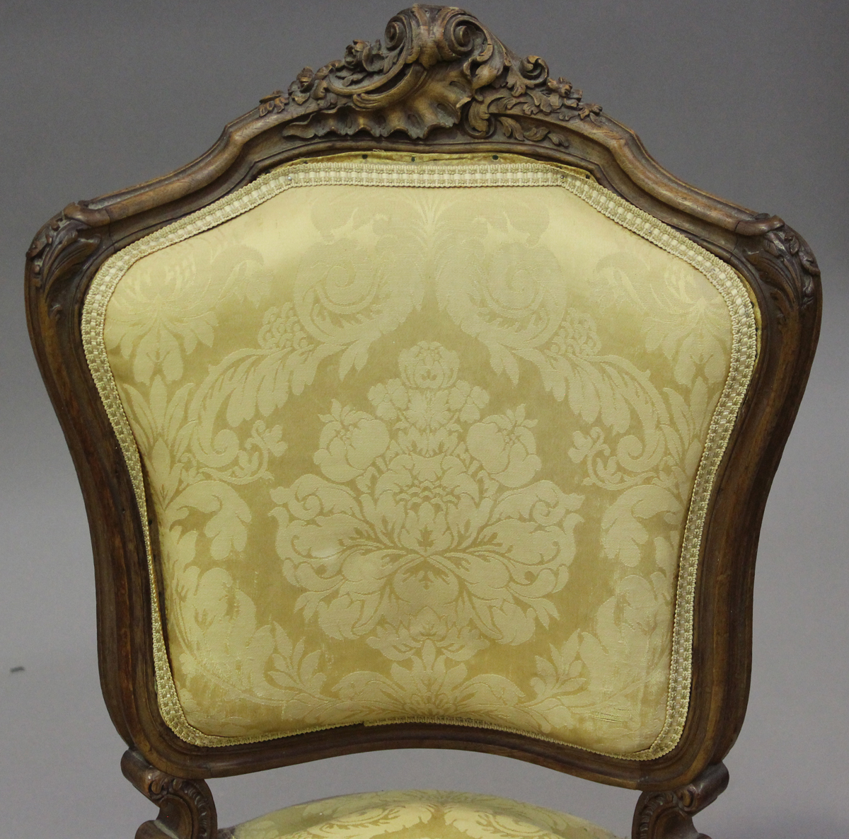 A late 19th century French Louis XV style walnut showframe salon suite, comprising a settee, - Image 8 of 12