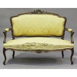 A late 19th century French Louis XV style walnut showframe salon suite, comprising a settee,