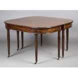 A George III mahogany 'D'-end dining table with central drop-flap section and reeded edge top,