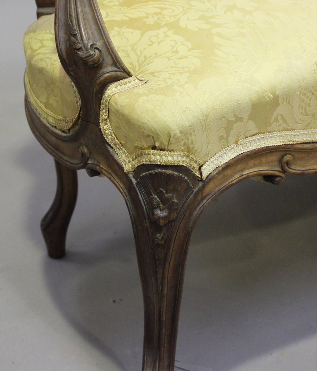 A late 19th century French Louis XV style walnut showframe salon suite, comprising a settee, - Image 3 of 12