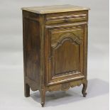 A 19th century French walnut side cabinet, fitted with a single drawer above an arched panel