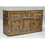 An 18th century and later oak dresser base, the front with applied geometric mouldings, height 86cm,