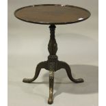 A 19th century mahogany tripod wine table, the dished top on a carved stem and tripod legs, height