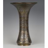 A 19th century Cairo ware brass vase, the waisted trumpet body overlaid in silver and copper with