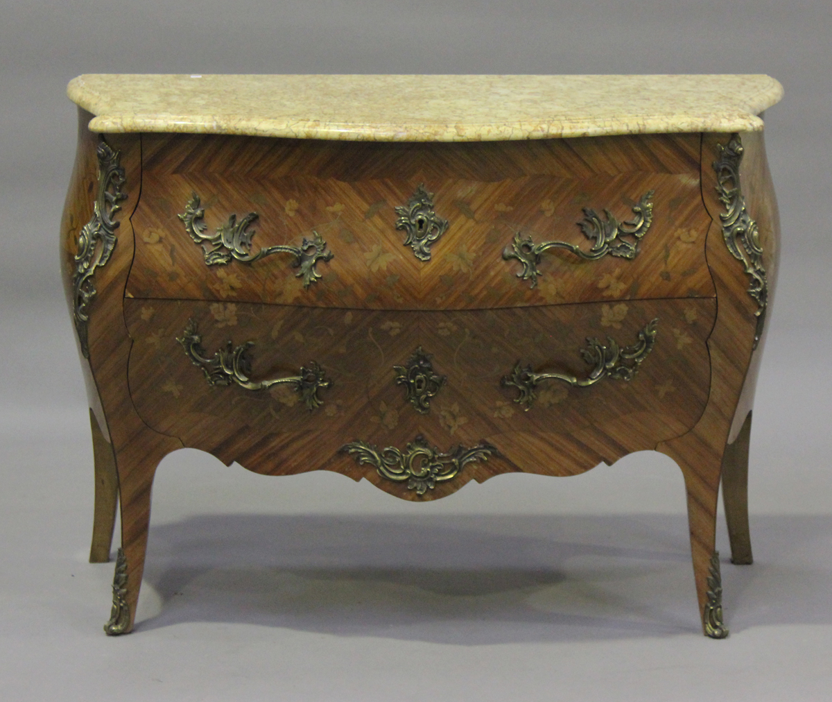 A 20th century French kingwood and foliate inlaid two-drawer bombé commode, the marble top above