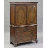 A 20th century Queen Anne style burr walnut cabinet by Waring & Gillow Ltd, the moulded pediment