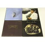 A collection of 1970s and 1980s LP records, including albums by Michael Jackson, Elton John,