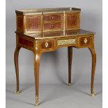 A late 19th/early 20th century French kingwood and thuya writing desk with overall applied gilt