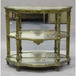 A mid-19th century French giltwood and gesso three-tier console display table, inset with mirrored