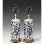 A pair of late 20th century Chinese blue and white porcelain hexagonal table lamps with twin-light