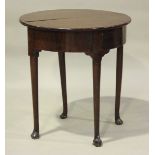 A small George II mahogany demi-lune fold-over tea table with double-hinged top, on turned legs with