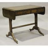 A 19th century mahogany sofa table with ebony line inlay, on twin supports and sabre legs, height