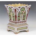 A late 19th century Gibbs & Canning of Tamworth terracotta majolica garden planter and stand, the
