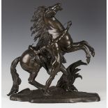 After Guillaume Coustou - a large late 19th century brown patinated cast bronze figure group of a