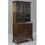 An early Victorian mahogany secrétaire bookcase cabinet, fitted with a pair of astragal glazed doors