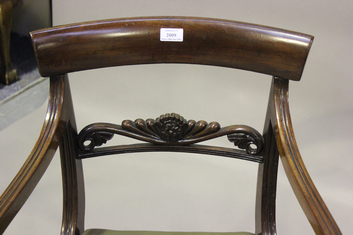 A pair of George IV mahogany bar back elbow chairs with foliate carved centre rails and green - Image 5 of 5