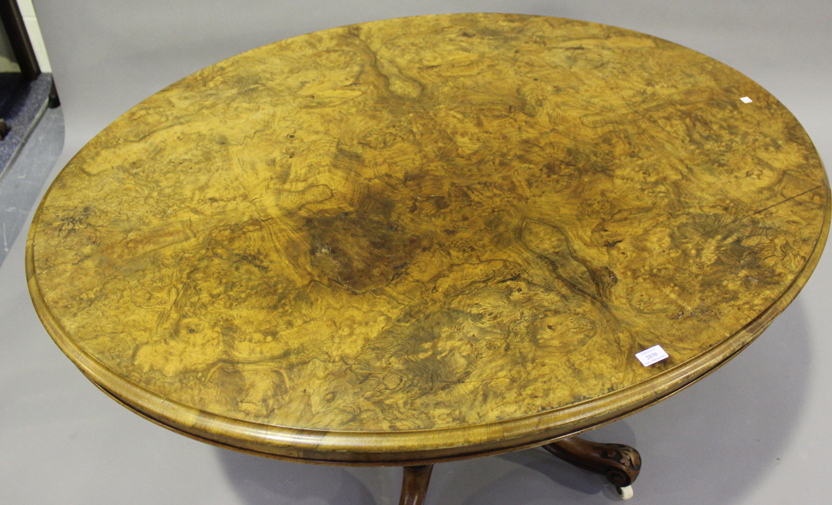 A late Victorian burr walnut oval tip-top breakfast table, raised on carved cabriole legs, height - Image 4 of 4