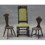 A 19th century Charles II style oak hall chair, height 114cm, width 47cm, together with two