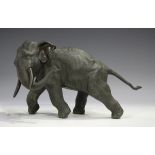 A Japanese brown patinated cast bronze figure of an elephant by Genryusai Seiya, Meiji period,