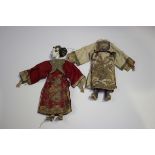 Two Chinese opera dolls, early 20th century, designed as a man and woman, each wearing original silk