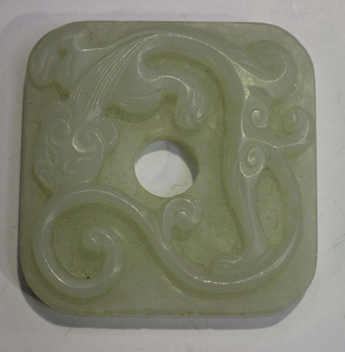 Two Chinese pale celadon jade pendants, late 19th/20th century, the first carved in the form of a - Image 8 of 8