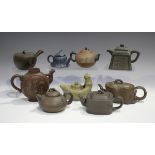 A group of nine Chinese Yixing stoneware teapots, 20th century and later, including a globular