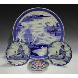 A pair of Japanese Arita blue and white porcelain plates, Meiji period, each painted with