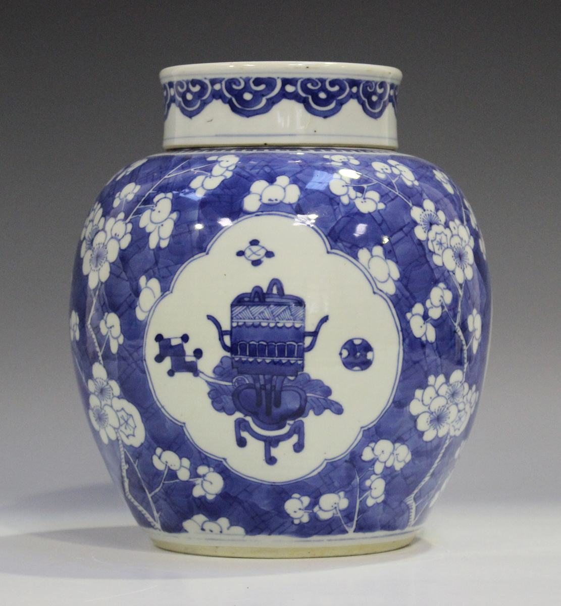 A Chinese blue and white porcelain ginger jar and cover, Kangxi period, painted with panels of
