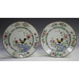 A pair of Chinese famille rose export porcelain plates, Yongzheng period, each centre finely painted