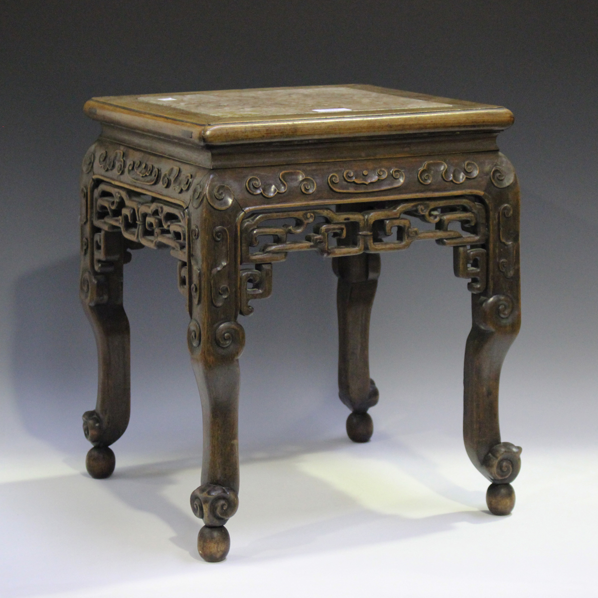 A Chinese hardwood jardinière stand, late 19th century, the square top inset with a rouge marble