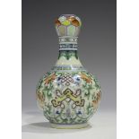 A Chinese doucai porcelain bottle vase, mark of Qianlong but modern, the bulbous body painted with