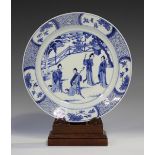 A Chinese blue and white porcelain circular dish, Kangxi period, the centre painted with two