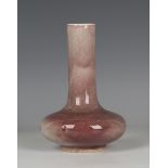 A Chinese peachbloom glazed bottle vase, mark of Kangxi but possibly later Qing dynasty, the low-