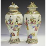 A pair of Chinese Canton famille rose porcelain vases and covers, mid-19th century, each high-