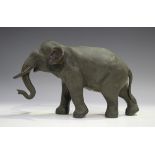 A Japanese brown patinated cast bronze figure of an elephant by Genryusai Seiya, Meiji period,